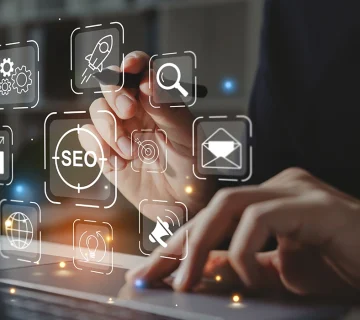 SEO concept showing digital marketing icons, search optimization tools, and business growth strategy on a laptop screen