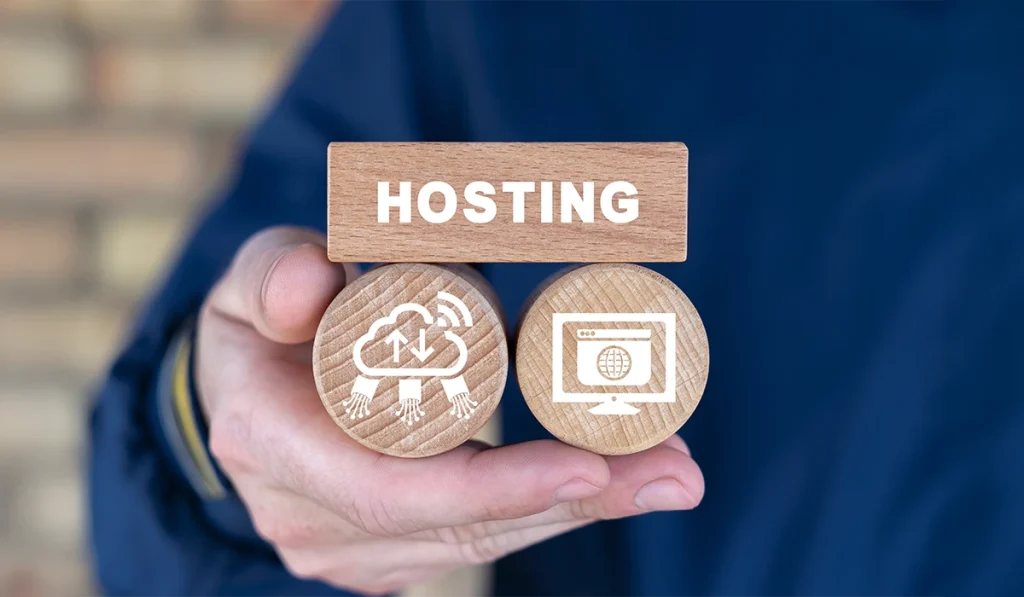 Hand holding web hosting icons representing cloud and website hosting solutions
