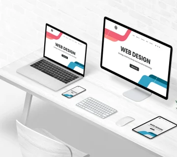 Website Development Agencies showcasing responsive web design across desktop, laptop, tablet, and mobile devices in a modern workspace 