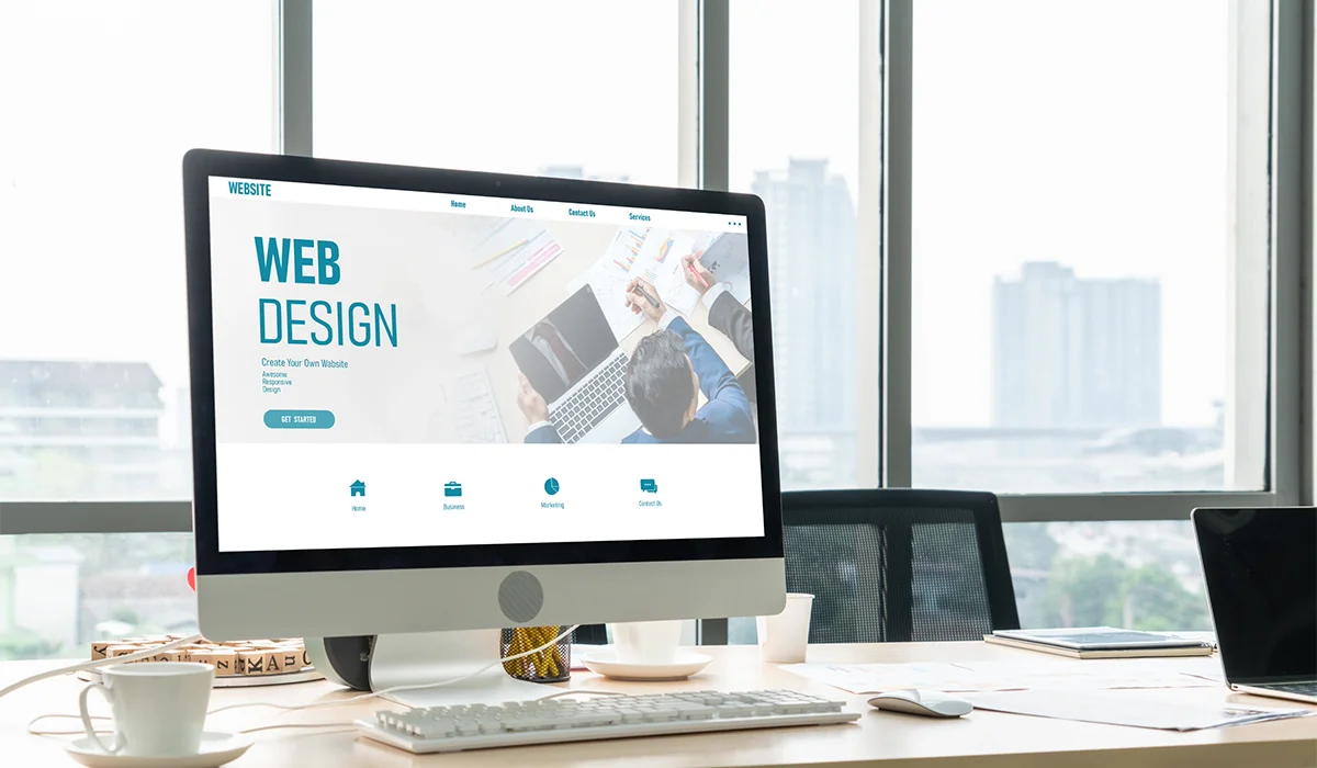 Web design website displayed on a desktop computer in a modern office workspace 