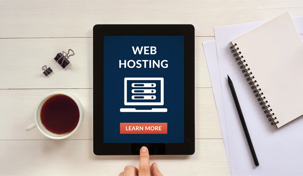 Web hosting concept on tablet screen with office objects